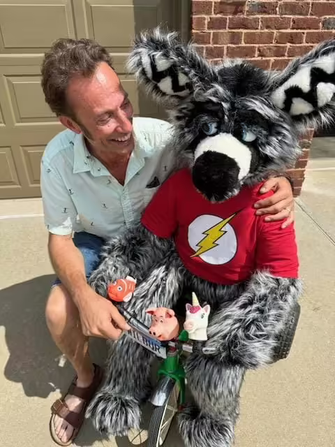 Brian Schultz posing with the latest version of Wilbur