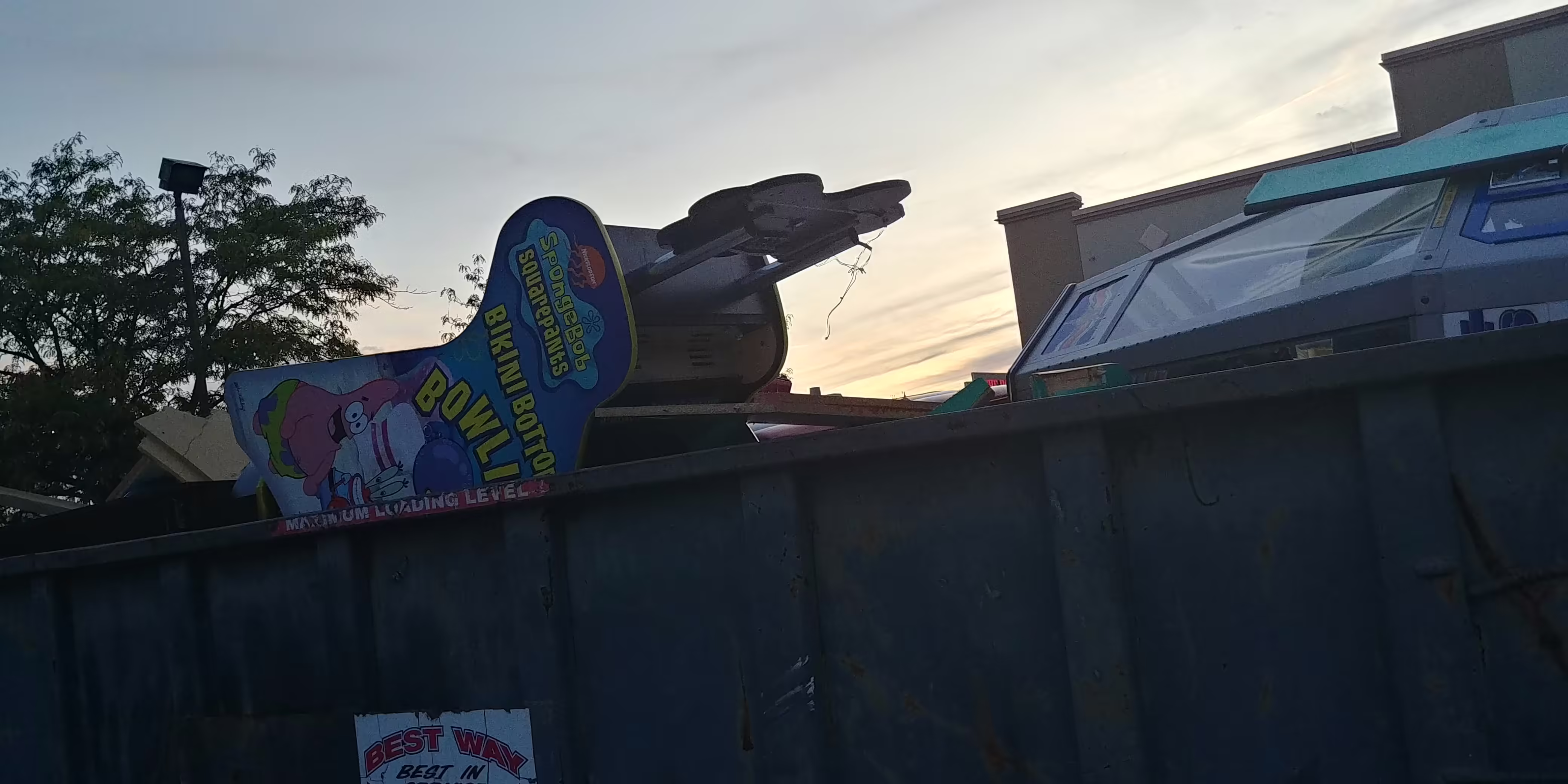 Photo of the Dumpster with several games in it.