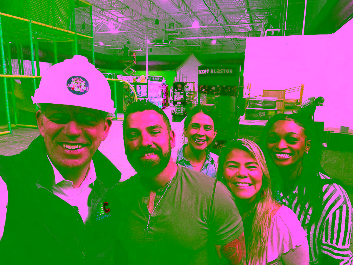 Adventure World interior during construction, showing employees and David McKillips