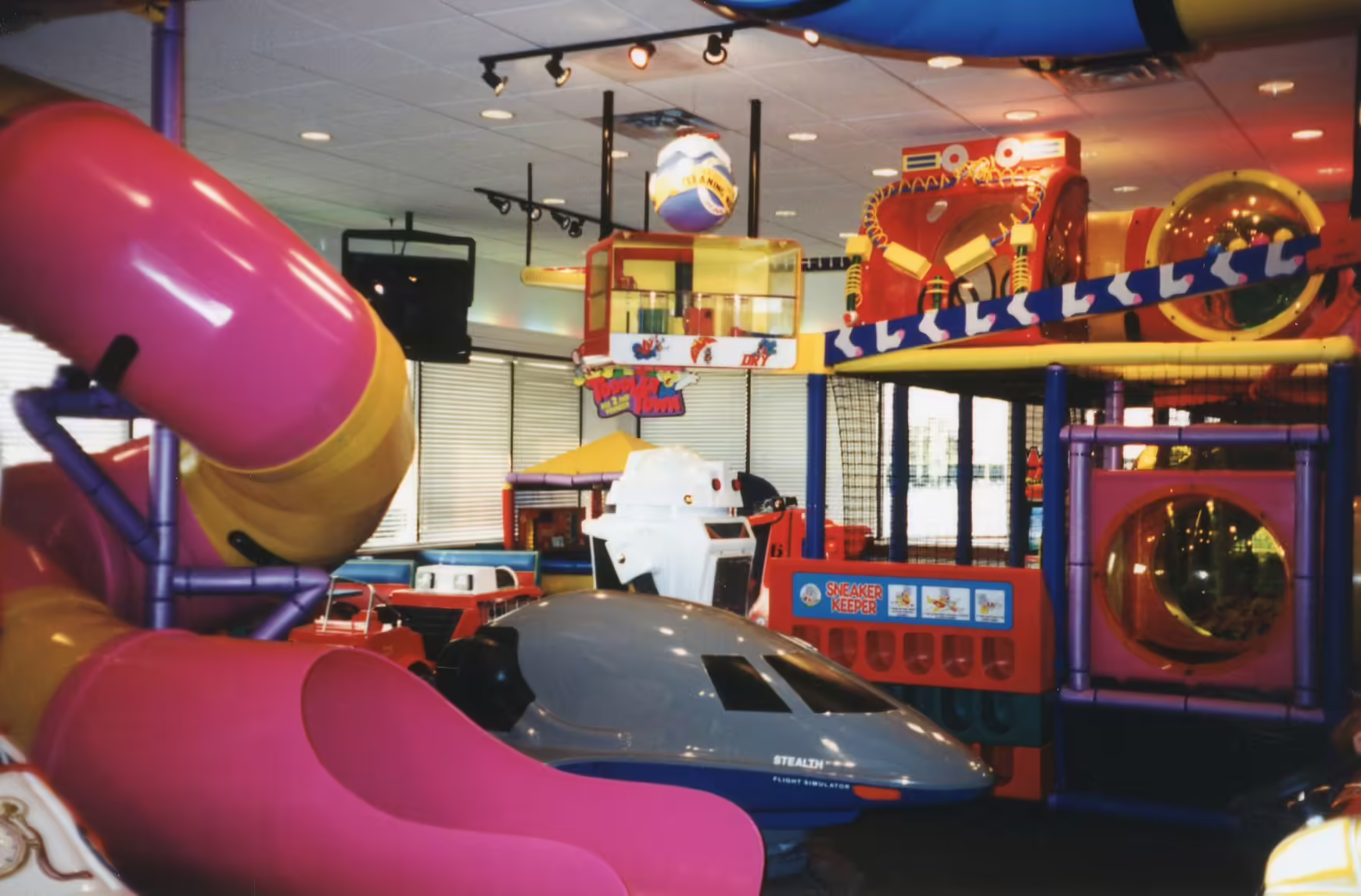 Refreshed gameroom with [[Phase 1 (1994)]] elements, and indirect rainbow lighting with crown molding.