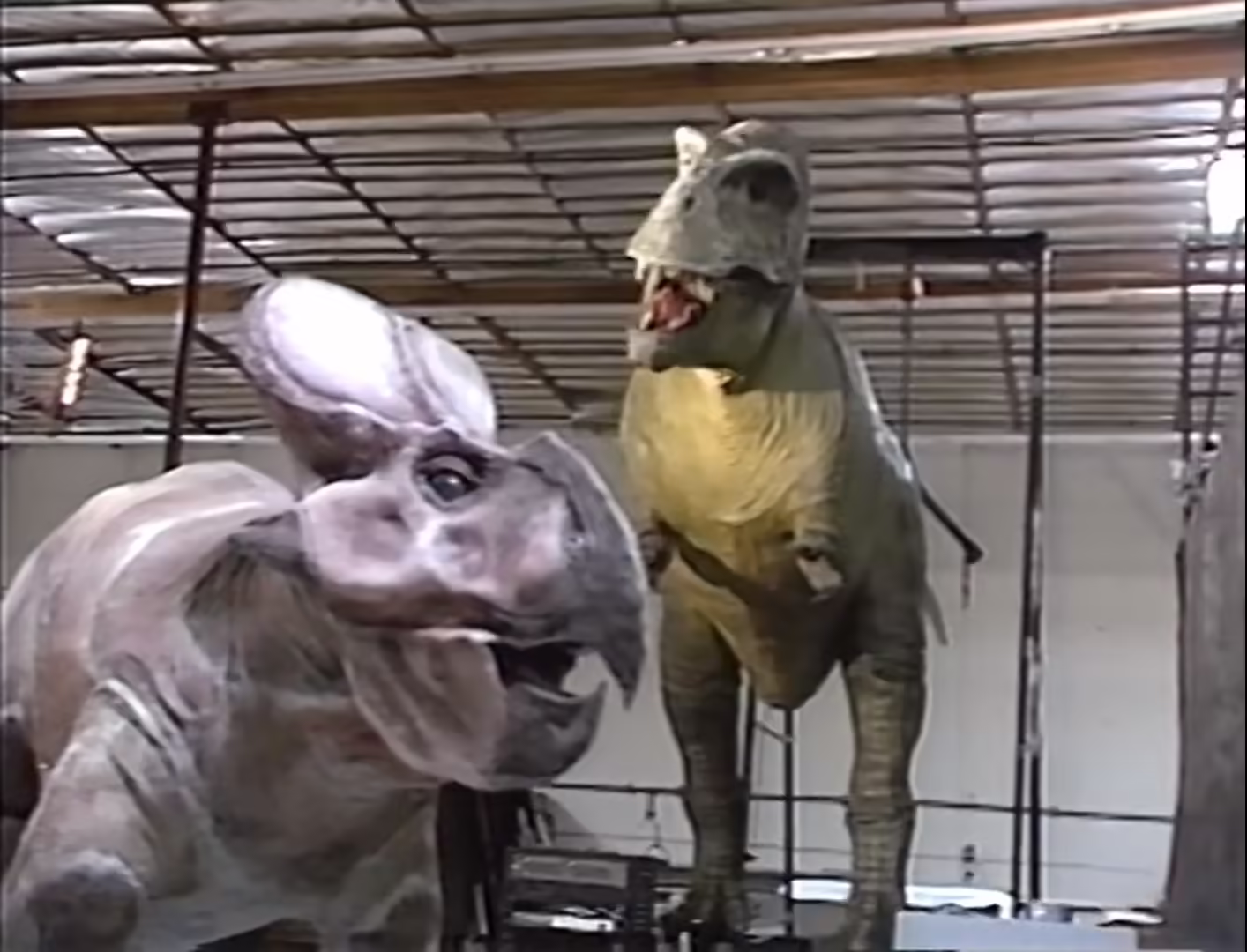 CPI Tarbosaur and Protoceratops posing for camera in Dinosaurs: Next Exit
