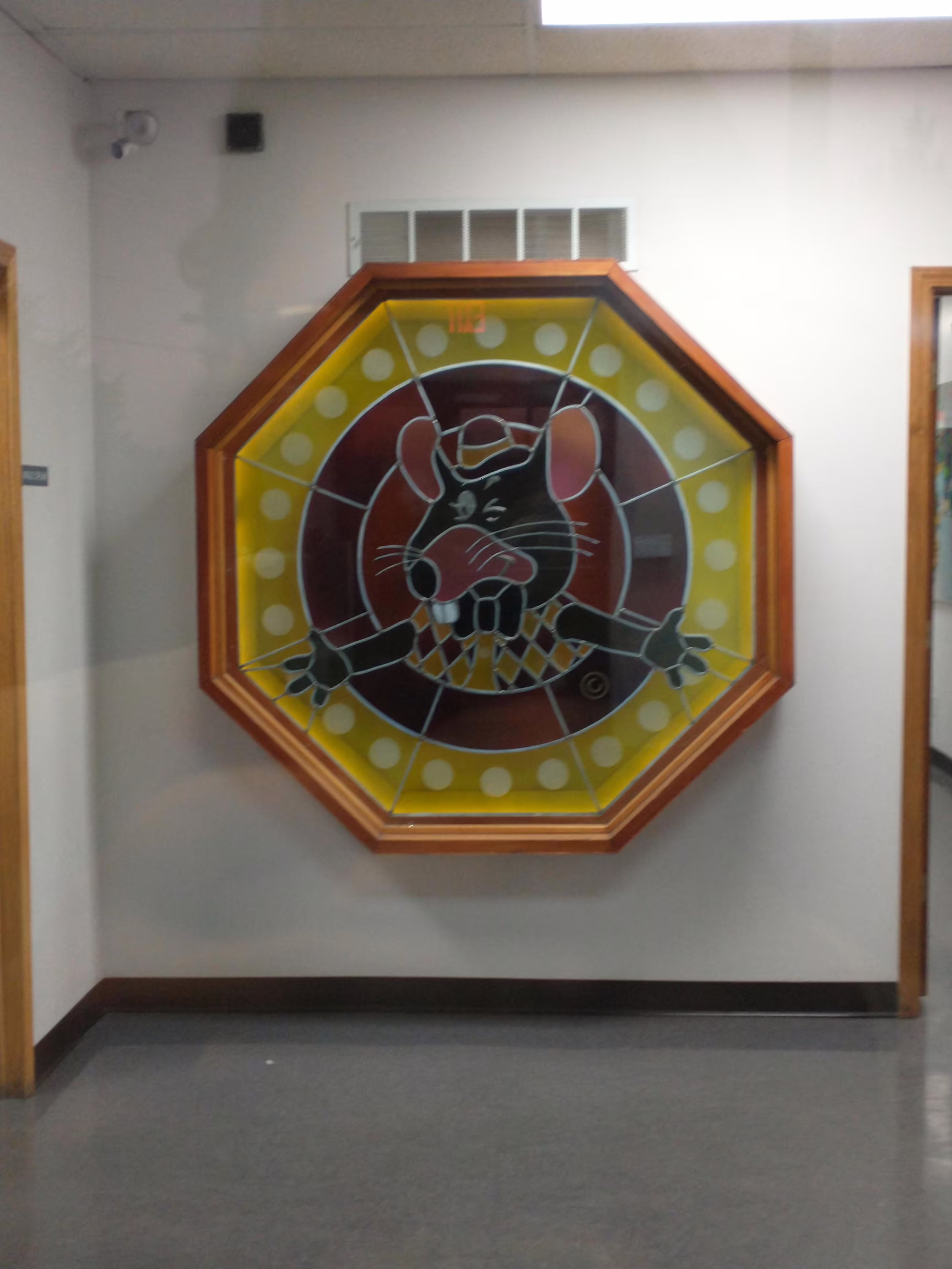 Stained Glass PTT logo in a hallway (Unknown Year)