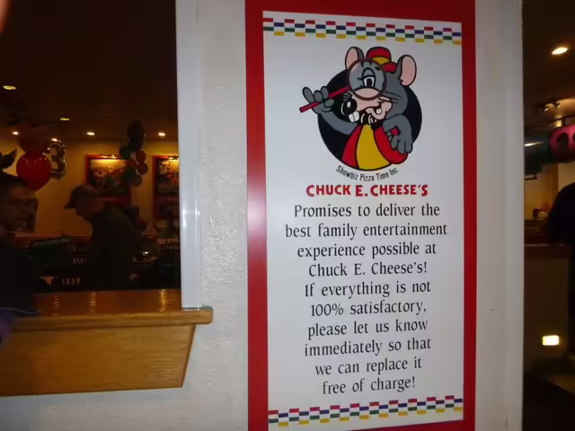 Sign located next to the showroom entrance.