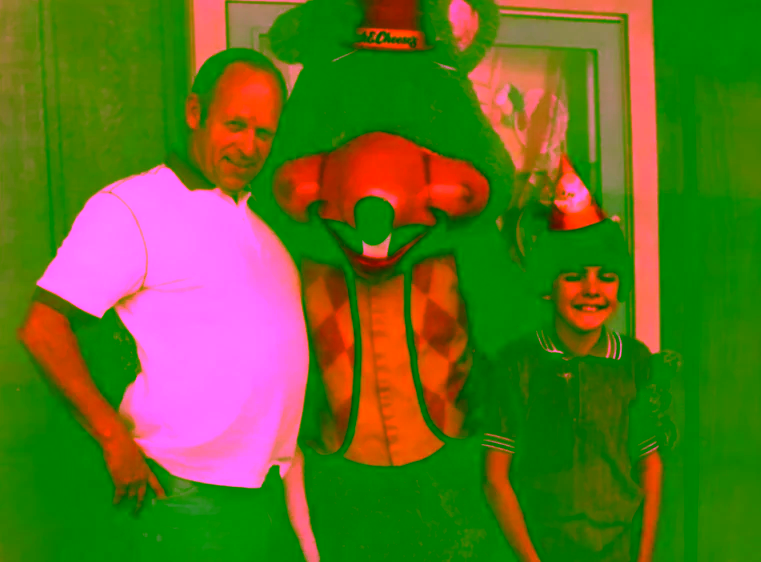 Chuck Walkaround posing with customers and showtape poster.